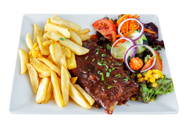 A barbecue pork dish with fresh grilled ribs, home fries and a salad with assorted vegetables. On a white insulated background.