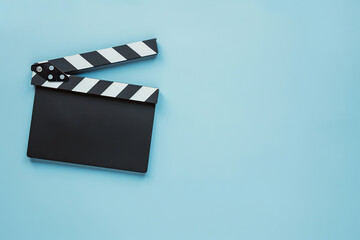 Clapper board on blue background