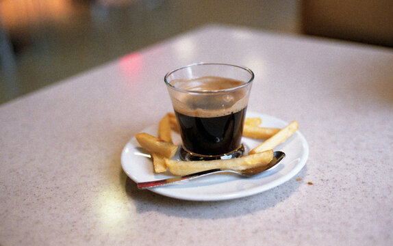Espresso Coffee and French Fries on Plate
