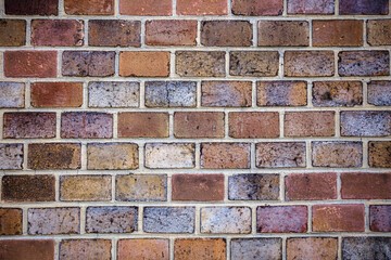 Red multicolor bricks wall background. Architecture backdrop