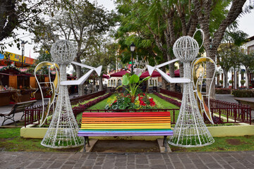 Christmas decorations and rainbow colors bench at Constitution square in La Orotava, Tenerife, Canary islands, Spain, travel Europe