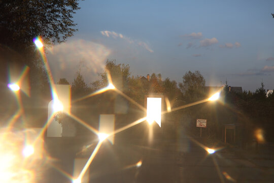 Handmade mirrors reflecting geometric light patterns in the forest