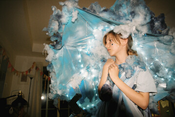 A girl in a costume as a rainy cloud