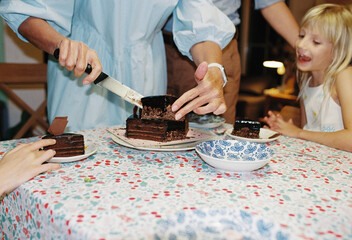 Senior woman cutting the cake