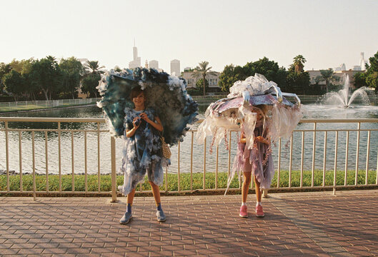 Two girls in costumes as a rainy cloud and a jellyfish