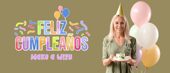 Mature woman with birthday cake and balloons on green background