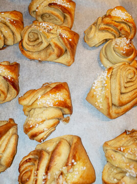 Freshly baked delicious sweet pastry cinnamon buns with direct flash