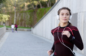 healthy happy woman jogging running outdoor listening music