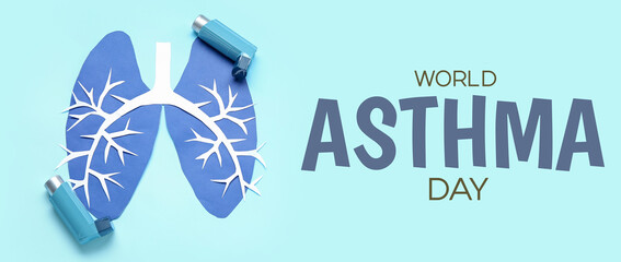 Paper lungs and asthma inhalers on blue background