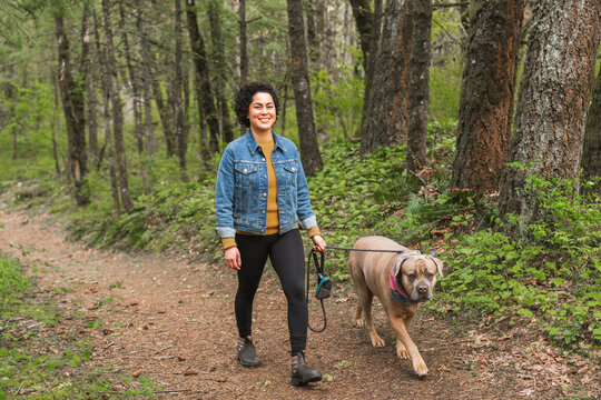 Woman walking her dog in nature