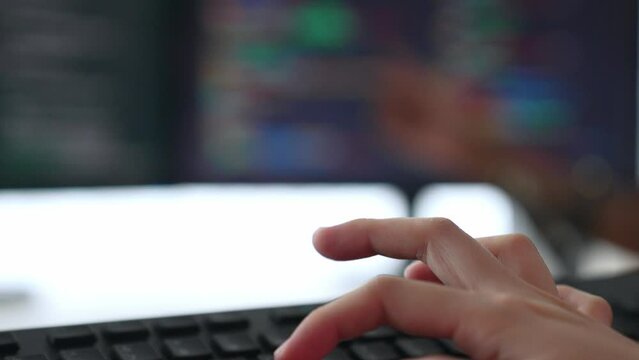 Slow motion closeup hand, back end software developer engineer for computer programming working together on debugging writing computing code, solving complex algorithms display on monitor. Burgeoning