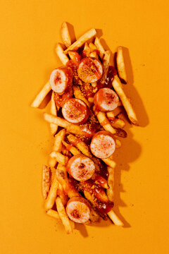 slices of currywurst and chips