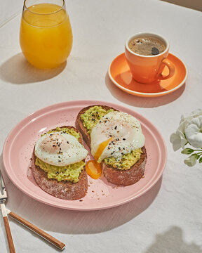 Healthy breakfast avocado toast with poached eggs