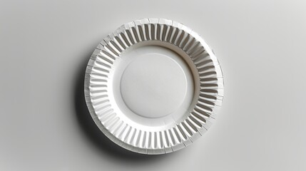 Disposable white paper plate isolated on white.