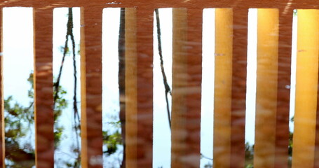 Architecture orange patterns pillars reflected on water surface