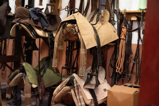 horse saddles in stable