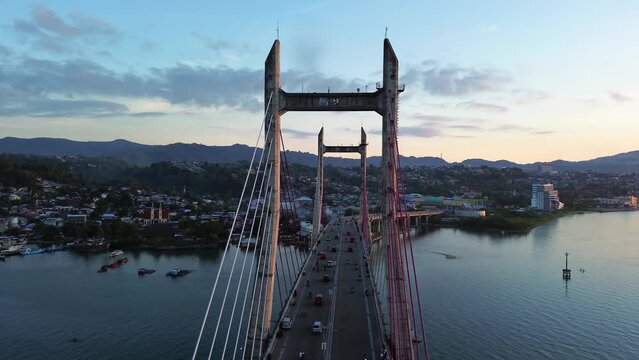Aerial View of Iconic Merah Putih Cable Stayed Bridge accross Ambon Bay and Wai Ruhu Galala Yellow Truss Bridge. 