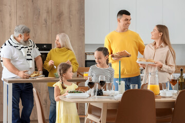 Big family having dinner in kitchen