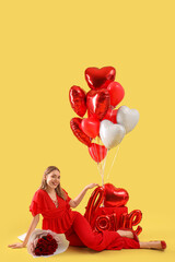 Young woman with roses and balloons on yellow background. Valentine's Day celebration