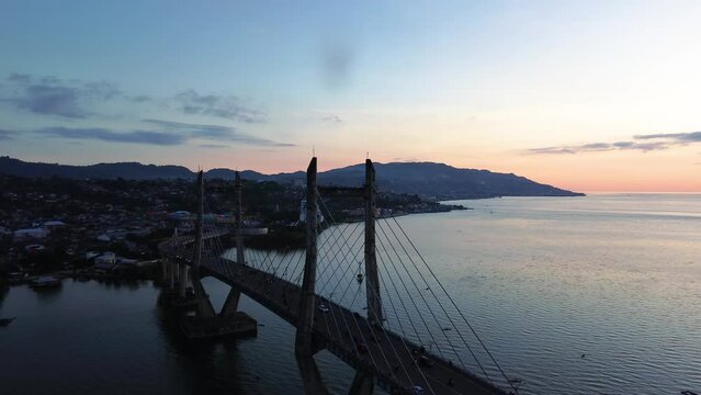 Aerial View of Iconic Merah Putih Cable Stayed Bridge accross Ambon Bay and Wai Ruhu Galala Yellow Truss Bridge. 