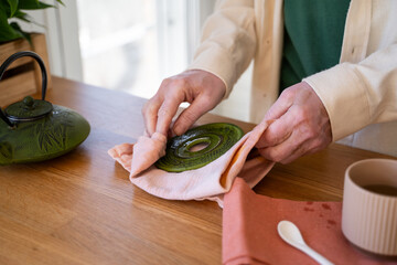man clean tea pot