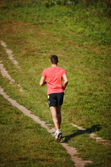 Man, trail running and outdoors with athlete for endurance with training for physical fitness. Male...