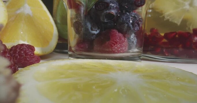 Fresh healthy berries scene composition set with macro shot of various fruits, probe dolly shot