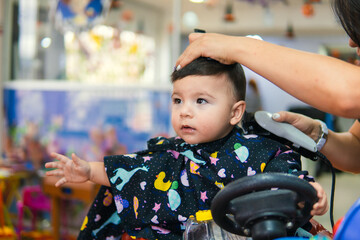 Baby haircut at a baby hairdresser