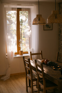 wooden table with light coming through window.