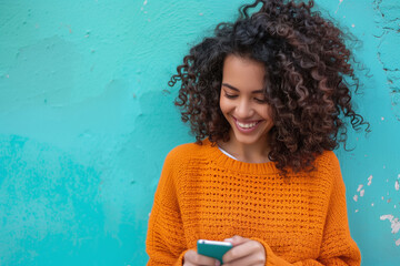Joyful Curly-Haired Woman Texting on Smartphone