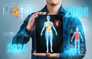 2024 Medical and tech health care :A man is holding a tablet with a picture of a human body organ,2024 Organ application tablet technology