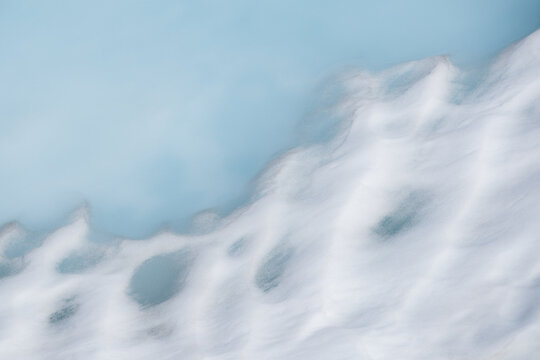 Abstract Blue Process Of Snow Melt