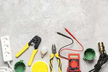 Set of electrician equipment on white grunge background