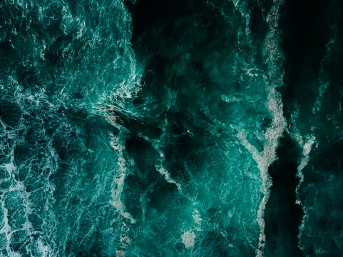 Top down aerial view of moody ocean wave