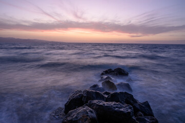 Fototapeta premium Sunset on Mediterranean Sea. Cloudy day.
