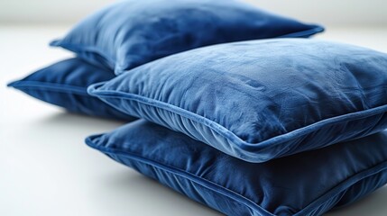 Blue pillow isolated on a white background, providing a top view with ample space for text or image inclusion.