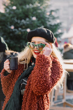 Cozy Elegance: Curly-haired Woman in Festive Splendor