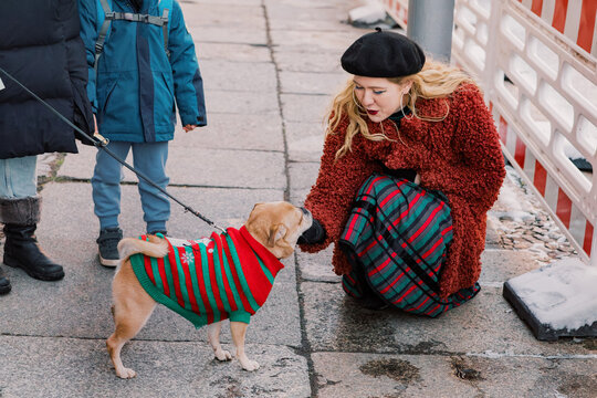 Blond Woman and Festive Pug on the Street