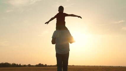 silhouette father carrying child boy his shoulders sunsethappy family, family outdoor activity, child piggyback father, bonding family silhouette., father and son play, childhood adventure piggyback - obrazy, fototapety, plakaty