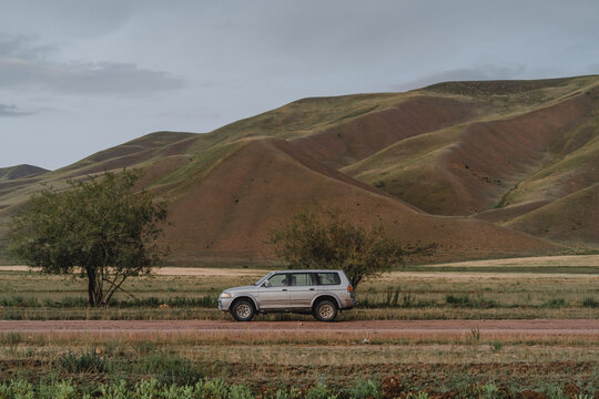 SUV car on off-road in remote location in the deserted land 