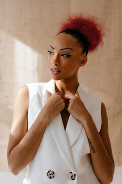 Thoughtful black woman holding flaps with hands