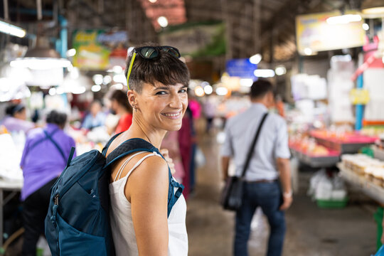 Tourist woman smiling.