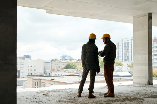 Two Male Builders At Work