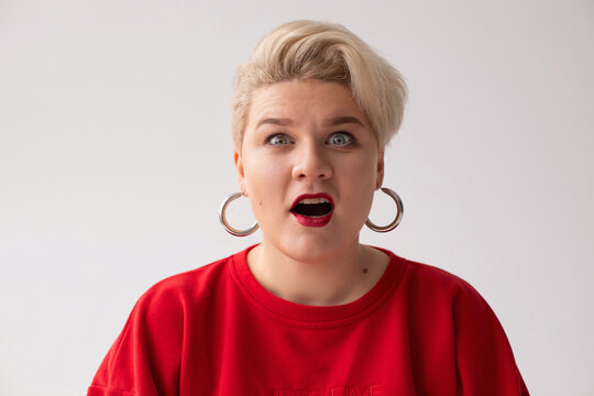 Shocked woman standing with opened mouth
