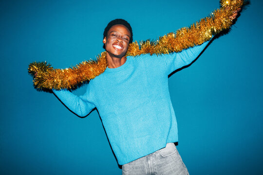Man with gold tinsel