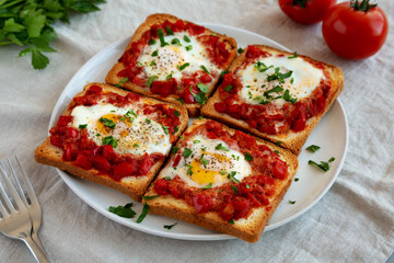 Homemade Sheet-Pan Shakshuka Toast on a Plate, side view.