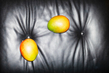 Photo of fresh juicy delicious mango fruit with hard direct flashlight