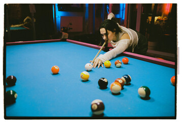 woman playing pool table snooker game