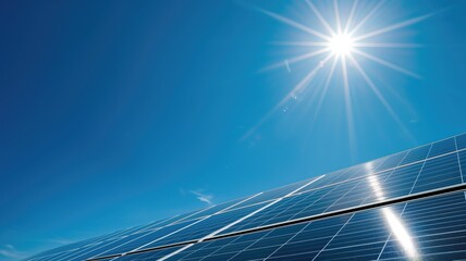 Solar panels with vibrant blue sky and radiant sun in background