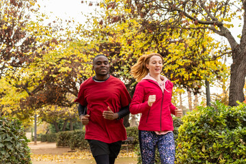 two friends doing sports in the city park